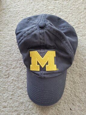 Like-new Michigan Wolverines cotton cap with maize Block M, metal clasp in back.